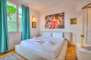 En eller flere senge i et værelse på Villa Marinella, Style History Serenity + 40 billeder