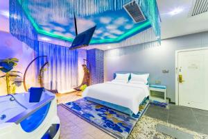 Ένα ή περισσότερα κρεβάτια σε δωμάτιο στο Star Dream Hotel