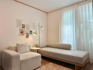 a living room with a couch and a chair at Modern 203 Stay in Seoul