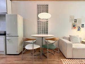 a living room with a table and a couch at Modern 203 Stay in Seoul