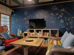 Et tv og/eller underholdning på みぃちゃの家 Casa di Micia おもや