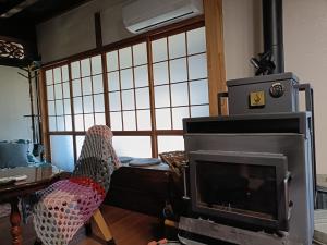 Et opholdsområde på みぃちゃの家 Casa di Micia おもや + 9 billeder