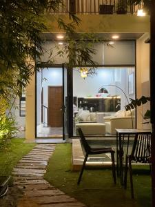 a living room with a couch and a table at Tehya Villa in Da Nang