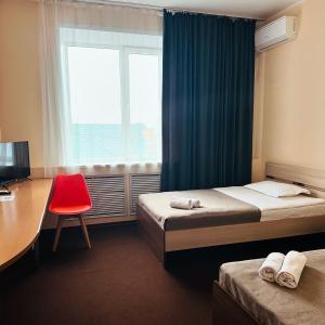 Postel nebo postele na pokoji v ubytování Гостиница "Сапсан"