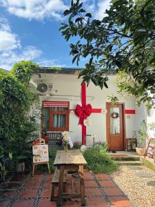 a house with a red bow on it at 1.Hôme in Hanoi