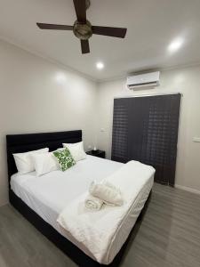 En eller flere senge i et værelse på Bang For Your Buck