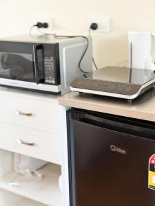 Η κουζίνα ή μικρή κουζίνα στο Kilbirnie Studio Near Everything +4 φωτογραφίες