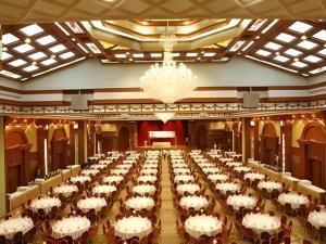 a large banquet hall with white tables and chairs at The Rizqun International Hotel in Kampong Kiulap +116 photos