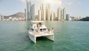 a group of people on a boat in the water at Noble Hotel in Yeosu