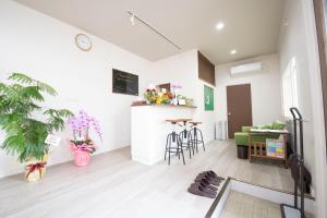 a living room with a kitchen and a table at Your Bedroom Hakone in Odawara