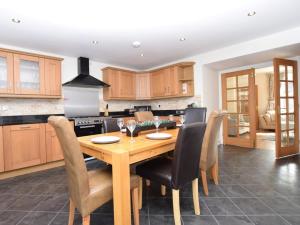 a kitchen with a wooden dining room table and chairs at 3 Bed in Belford oc-76672 in Belford