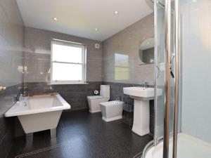 a bathroom with a sink and a tub and a toilet at 3 Bed in Belford oc-76672 in Belford +42 photos