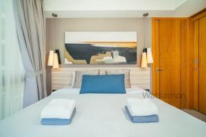 Ένα ή περισσότερα κρεβάτια σε δωμάτιο στο Oceanstone Condo 2 bedrooms BangTao Laguna