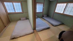 Postel nebo postele na pokoji v ubytování 季一号馆