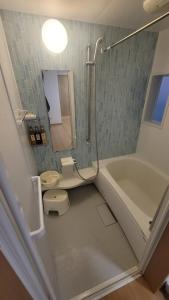 Koupelna v ubytování 季一号馆 + 8 fotografií