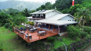 an aerial view of a house with a deck at Pension Mave Mai in Nuku Hiva