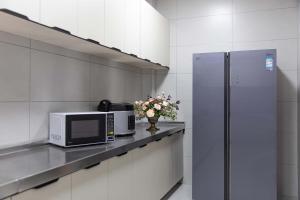 Η κουζίνα ή μικρή κουζίνα στο LAKHAM DAR. YuYueju Boutique Stay