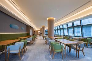 En restaurant eller et andet spisested på JI Hotel Nanjing National Agricultural Innovation Center