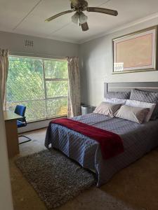 Ένα ή περισσότερα κρεβάτια σε δωμάτιο στο 1 Malva rd, Croydon