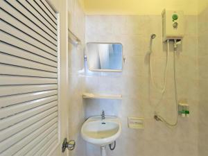 a bathroom with a sink and a shower at Krabi Grand Place Hotel in Ban Khlong Chi Lat +164 photos