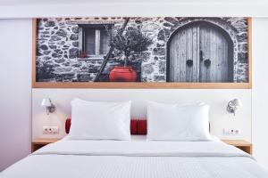 Postel nebo postele na pokoji v ubytování Olive Green Hotel