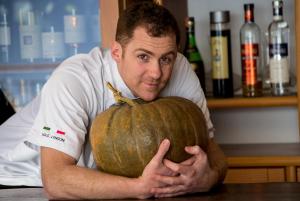 a man is holding a large pumpkin at Ristorante Bellavista con Locanda in Veleso +61 photos