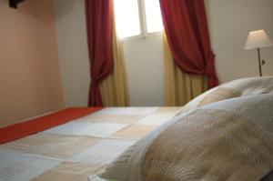 Postel nebo postele na pokoji v ubytování Rutas Hotel