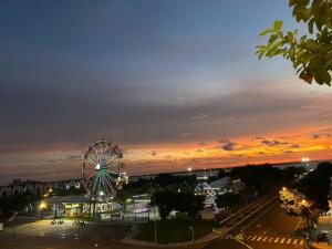 a ferris wheel in a park at sunset at Khách sạn Phúc Đạt - Rạch Giá Phúc Đạt Hotel in Ấp Rạch Mẹo