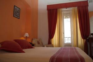 Postel nebo postele na pokoji v ubytování Rutas Hotel