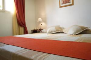 Postel nebo postele na pokoji v ubytování Rutas Hotel