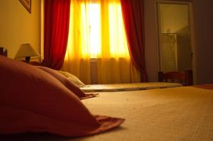 Postel nebo postele na pokoji v ubytování Rutas Hotel