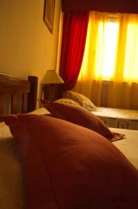 Postel nebo postele na pokoji v ubytování Rutas Hotel