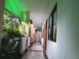 a hallway of a house with a door and a window at N-Joy Place in Surin