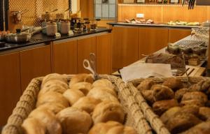 a large pile of food on a table in a kitchen at Hotel-Restaurant Gasthaus Bonimeier in Niedergottsau