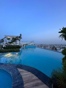 a view of a swimming pool at a resort at A N Studio Room, The Grand Anukampa in Jaipur