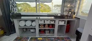 a toy kitchen with a counter and a sink at Gangi Kota Penthouse in Kovvūr