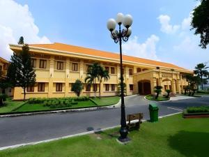 a building with a street light in front of it at Tan Son Nhat Hotel in Ho Chi Minh City