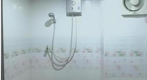 a shower in a bathroom with a tub at Ban Bua Resort and Hotel in Ban Si Than +40 photos