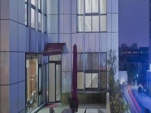 a rendering of a building with a view of a street at Changshu Please Hotel in Changshu