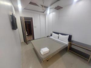 En eller flere senge i et værelse på Hotel O by OYO Ashoka's Planet Inn