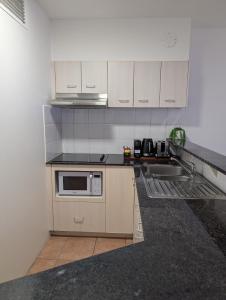 Η κουζίνα ή μικρή κουζίνα στο Inn Cairns