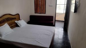 Rúm í herbergi á HOTEL O RASRANG +20 myndir