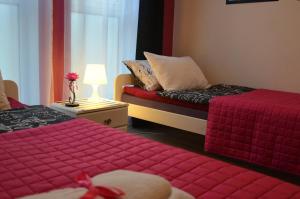 Posteľ alebo postele v izbe v ubytovaní Apartamenty Szczęśliwe Sny