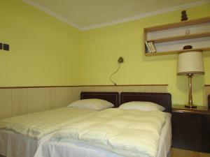 Letto o letti in una camera di Fülöp Vendégház