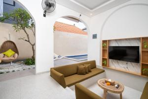 Μια τηλεόραση ή/και κέντρο ψυχαγωγίας στο 3Bedrooms Escape Villa Legian Near Doublesix Beach