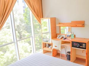 Ένα ή περισσότερα κρεβάτια σε δωμάτιο στο An Hotel Jakarta