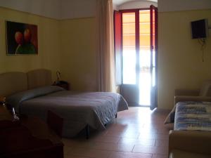 Postel nebo postele na pokoji v ubytování B&B Frammenti D'Itria