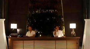 two people sitting at a desk in front of a mirror at Chivaree Hotel and Resort in Ban Mu Dut +212 photos