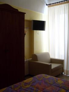 TV a/nebo společenská místnost v ubytování B&B Frammenti D'Itria
