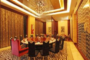 a large dining room with a table and chairs at Fortune International Hotel in Xingyin Wanfenglin Airport +251 photos